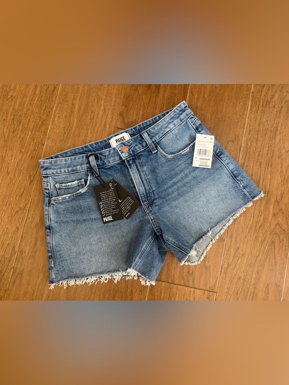 New with tags. Paige Dylan Dance Queen distressed cutoff blue denim shorts Sz 27
